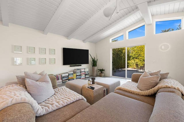 living room with high vaulted ceiling and beam ceiling