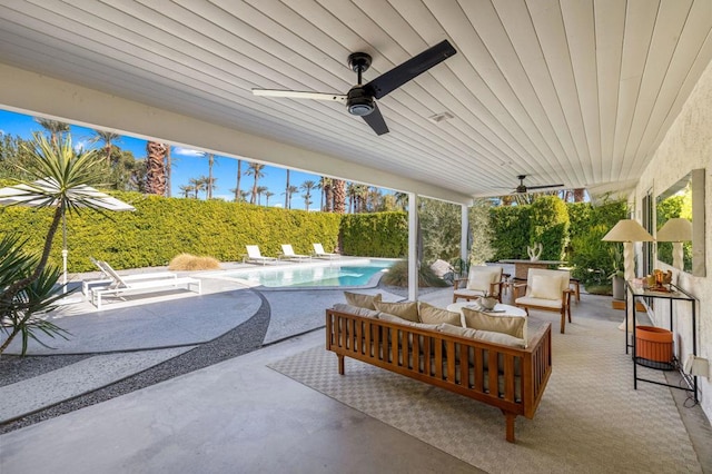 view of patio / terrace with an outdoor living space, ceiling fan, and a fenced in pool