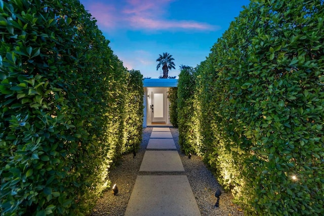 view of exterior entry at dusk