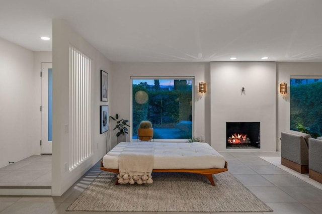 bedroom featuring light tile patterned flooring