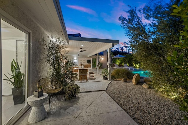 patio terrace at dusk with ceiling fan