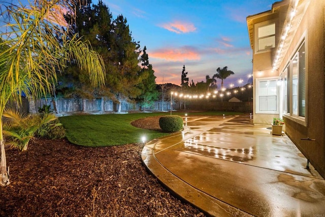 view of yard at dusk