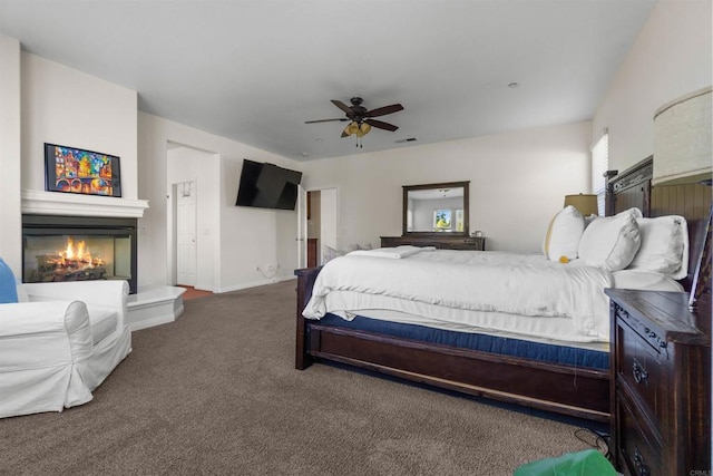 bedroom featuring ceiling fan and carpet