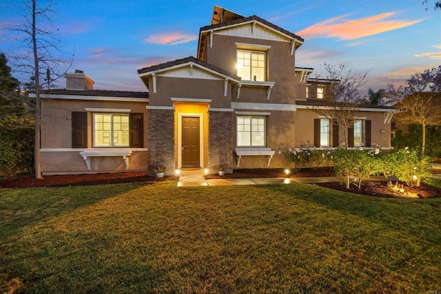 view of property featuring a lawn