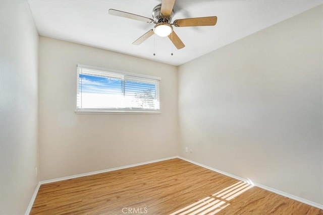 unfurnished room with ceiling fan and light wood-type flooring