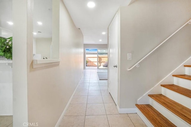 corridor featuring light tile patterned floors