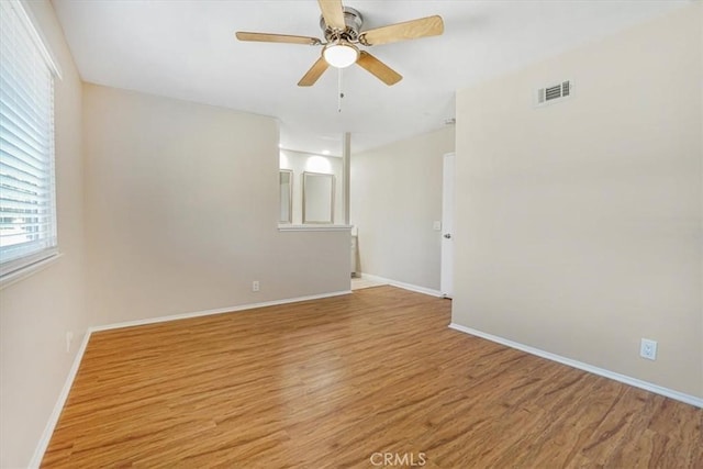 unfurnished room featuring ceiling fan and light wood-type flooring