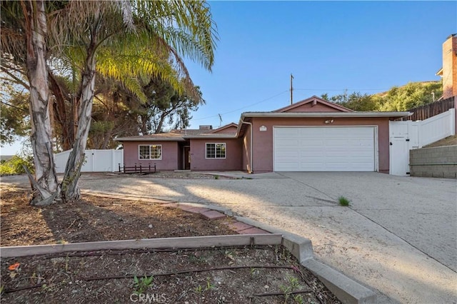 ranch-style home featuring a garage