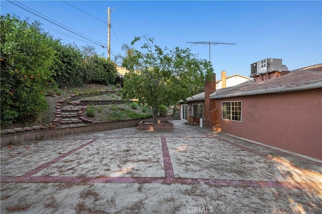 view of yard with a patio area and central AC unit