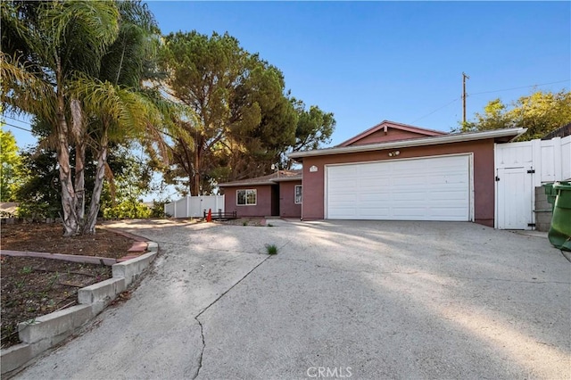 single story home with a garage