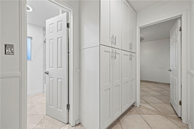 hallway with light tile patterned floors