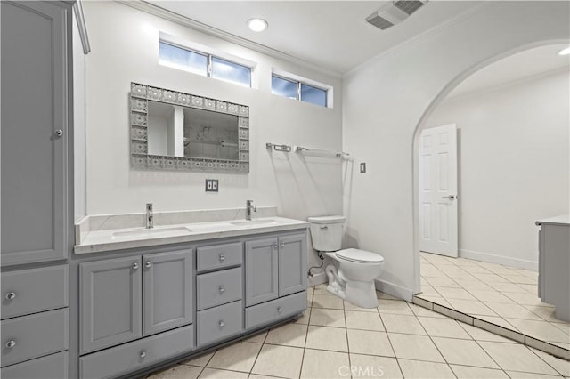 bathroom featuring ornamental molding, toilet, tile patterned floors, and vanity