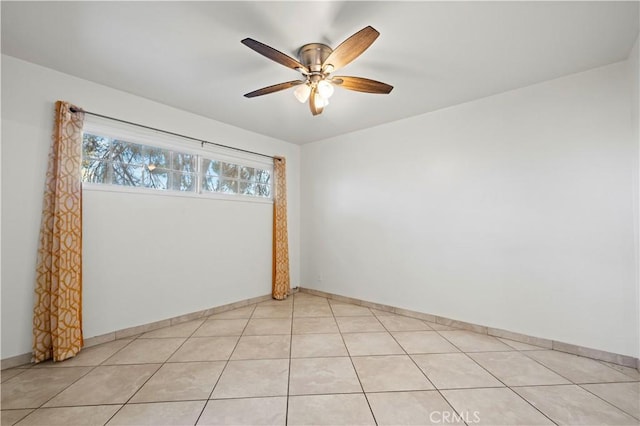 tiled empty room with ceiling fan