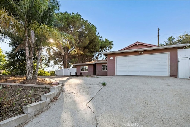 ranch-style house featuring a garage