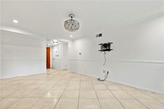 tiled empty room with ornamental molding