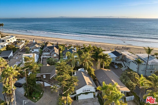 aerial view featuring a water view and a view of the beach