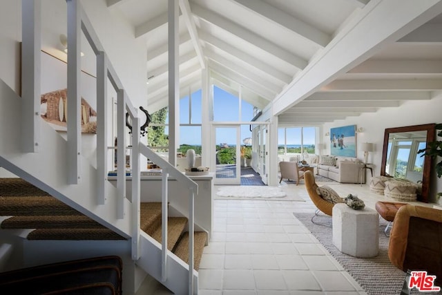 interior space featuring lofted ceiling with beams