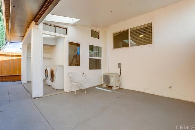 view of patio / terrace featuring washing machine and clothes dryer