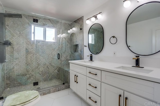 bathroom featuring a shower with door, toilet, tile patterned floors, and vanity