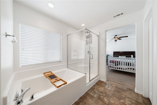 bathroom featuring ceiling fan and plus walk in shower