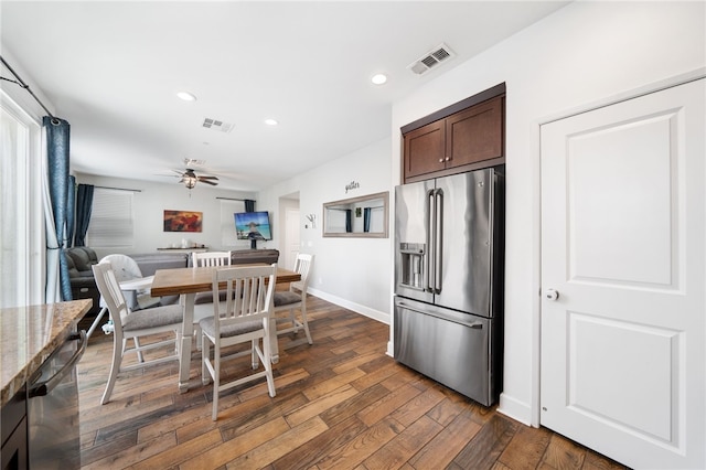 kitchen featuring ceiling fan, dark wood-type flooring, dark brown cabinetry, and appliances with stainless steel finishes