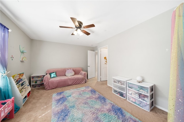 game room featuring ceiling fan and light colored carpet