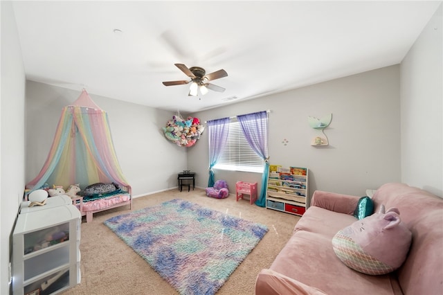 recreation room with carpet flooring and ceiling fan