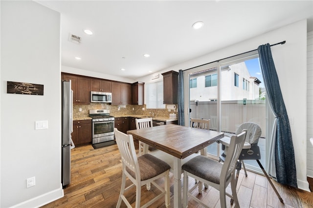 dining space featuring light hardwood / wood-style floors