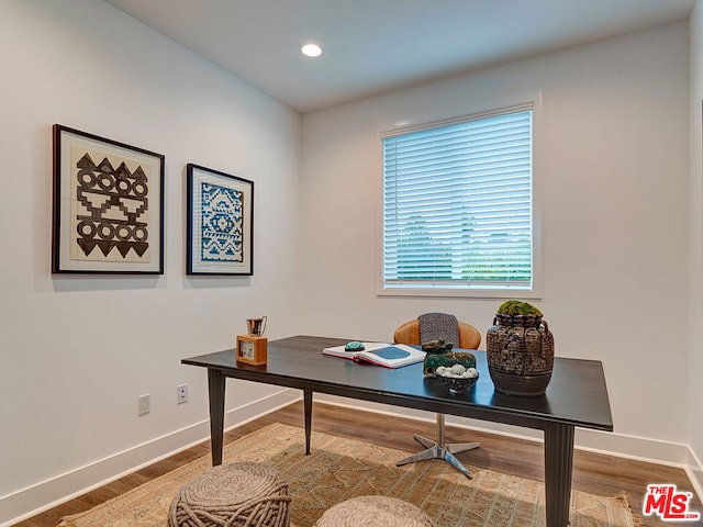 office area with wood-type flooring