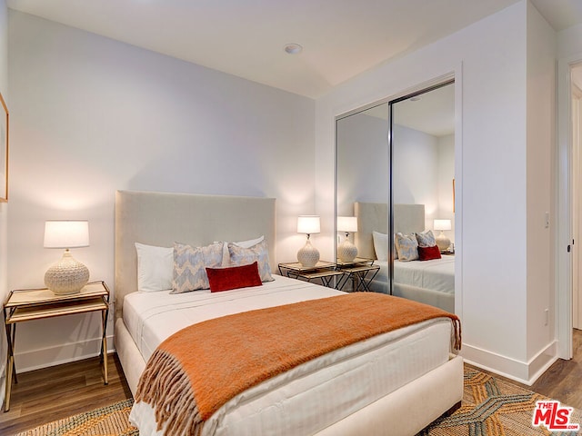 bedroom featuring a closet and hardwood / wood-style flooring