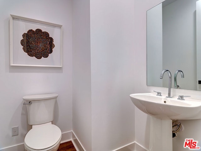 bathroom with sink and toilet