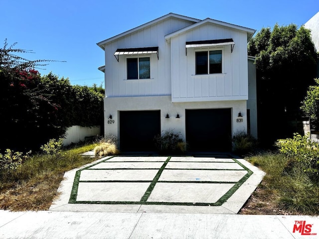 modern farmhouse style home featuring a garage