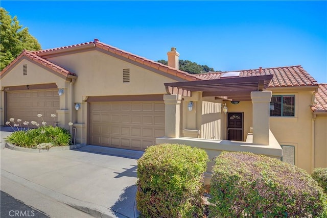 6279 Twinberry Cir Unit 7, Avila Beach, CA 93424 - mediterranean / spanish house with stucco siding, a garage, driveway, and a tiled roof