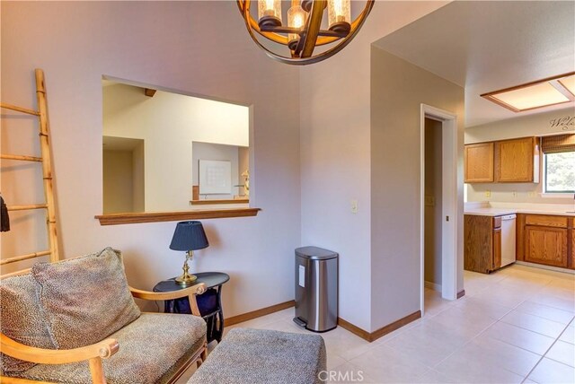 6279 Twinberry Cir Unit 7, Avila Beach, CA 93424 - living area with light tile patterned floors and a chandelier