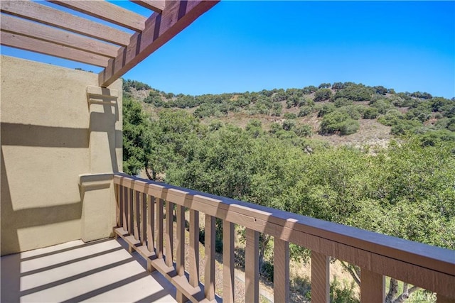 6279 Twinberry Cir Unit 7, Avila Beach, CA 93424 - balcony featuring a pergola and a view of trees