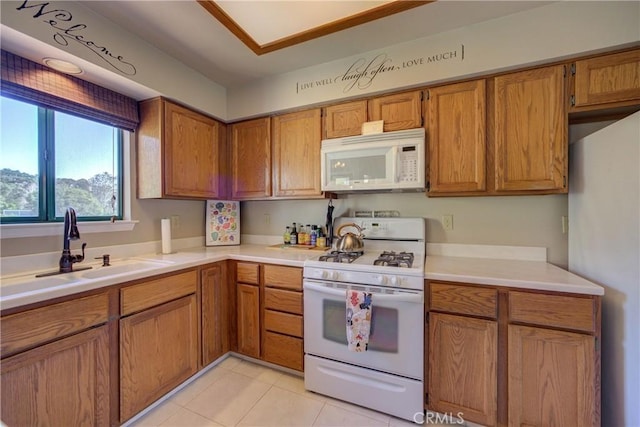 6279 Twinberry Cir Unit 7, Avila Beach, CA 93424 - kitchen featuring white appliances, brown cabinetry, light countertops, and light tile patterned floors