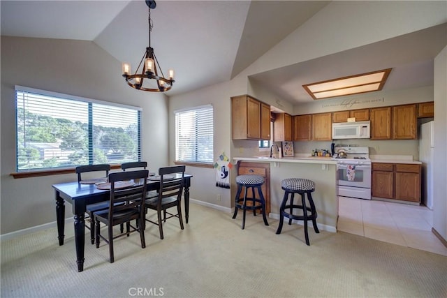 6279 Twinberry Cir Unit 7, Avila Beach, CA 93424 - dining space featuring lofted ceiling, light carpet, and a chandelier