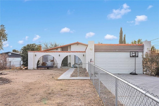 rear view of house with a garage