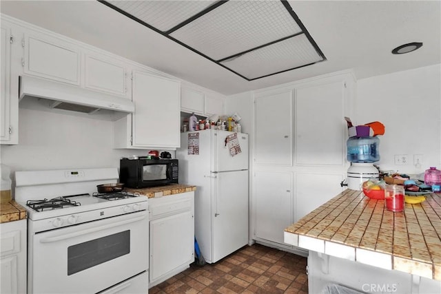 kitchen featuring white appliances, white cabinets, and under cabinet range hood