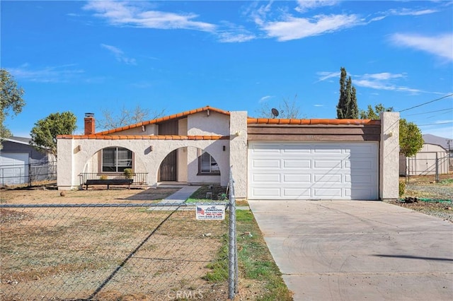 view of front of house featuring a fenced front yard, stucco siding, a porch, concrete driveway, and an attached garage