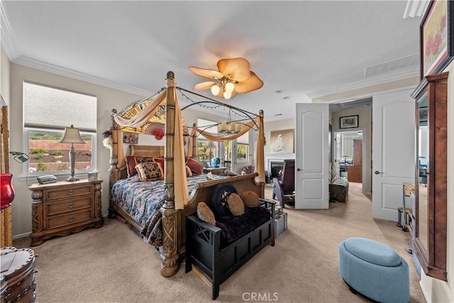 carpeted bedroom with crown molding and ceiling fan