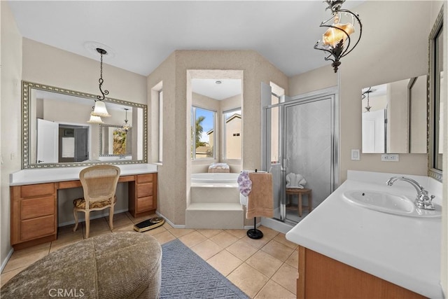 bathroom featuring independent shower and bath, vanity, and tile patterned floors