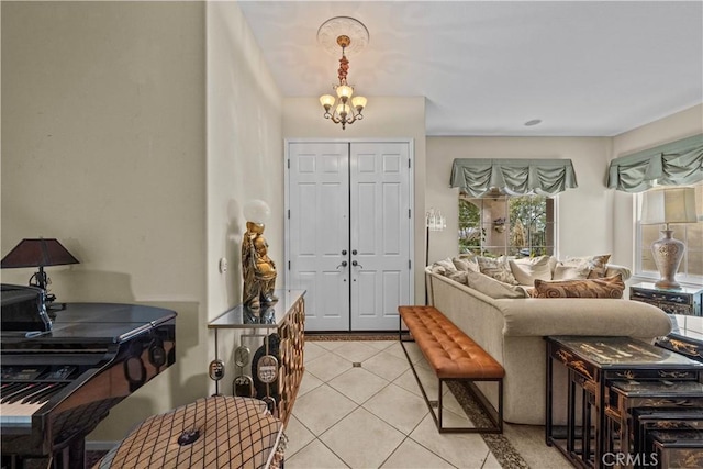 living room with light tile patterned floors and a notable chandelier