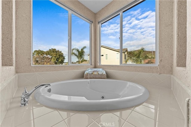 bathroom with tiled bath