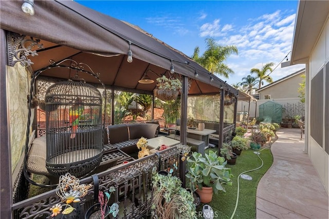 view of patio featuring a gazebo and outdoor lounge area