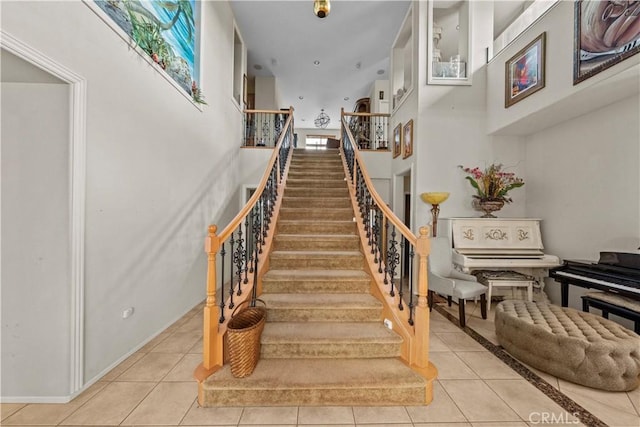 stairs featuring tile patterned floors