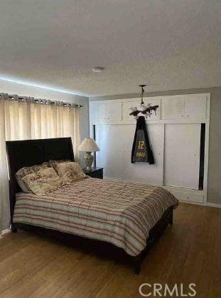 bedroom with hardwood / wood-style flooring