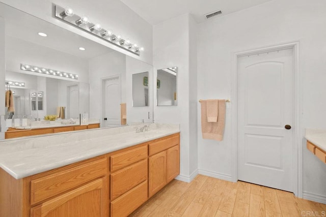 bathroom featuring vanity and wood-type flooring