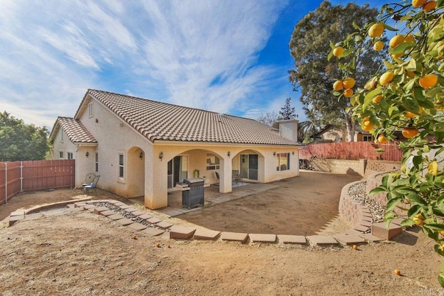 rear view of house with a patio area