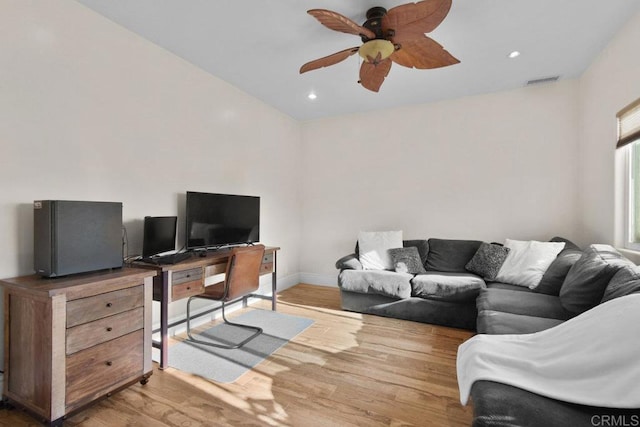 home office featuring hardwood / wood-style flooring and ceiling fan